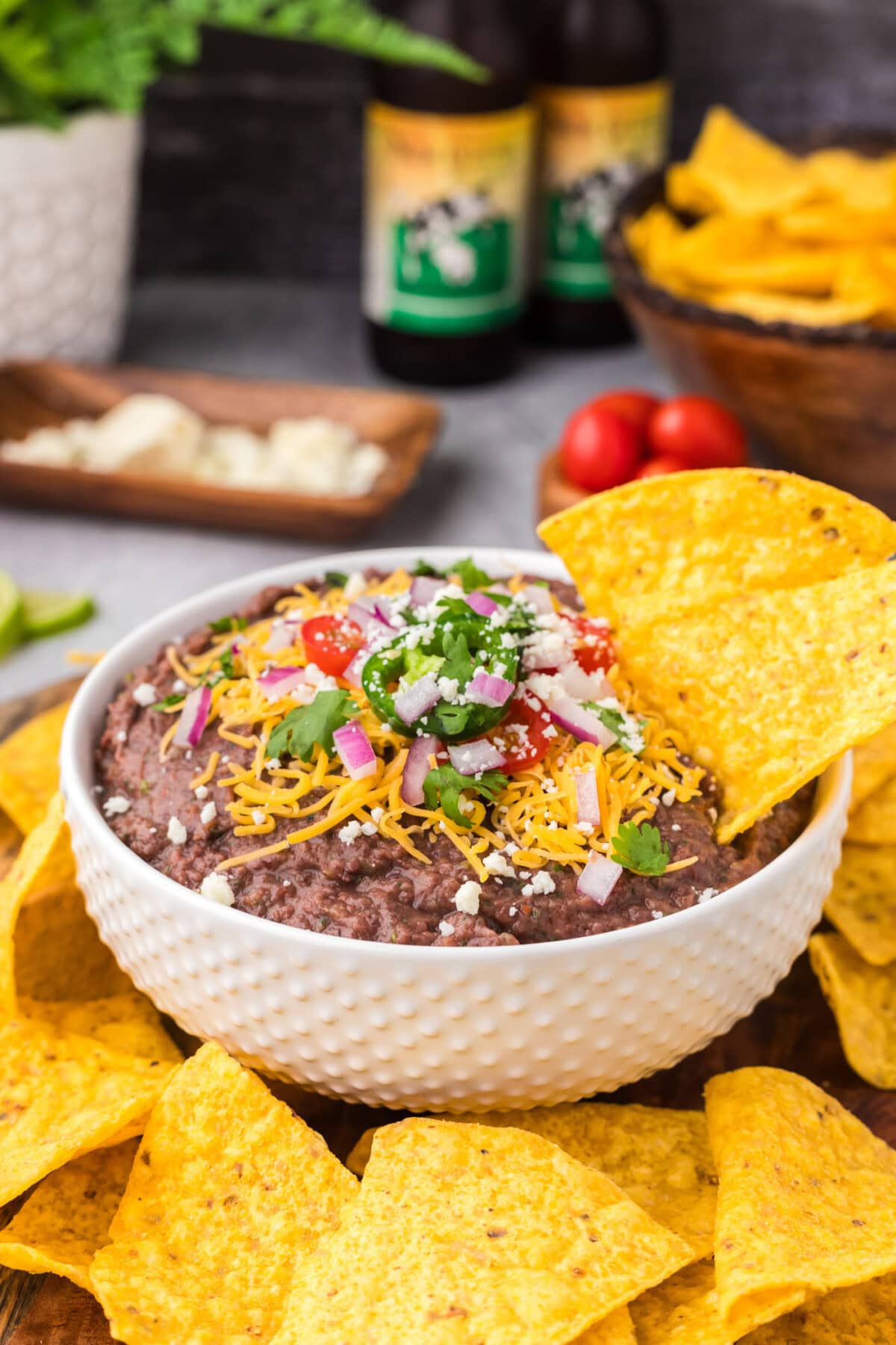 Tortilla chip in a bowl of Black Bean Dip
