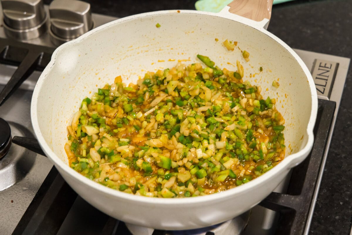 holy trinity vegetables with seasoning in a skillet