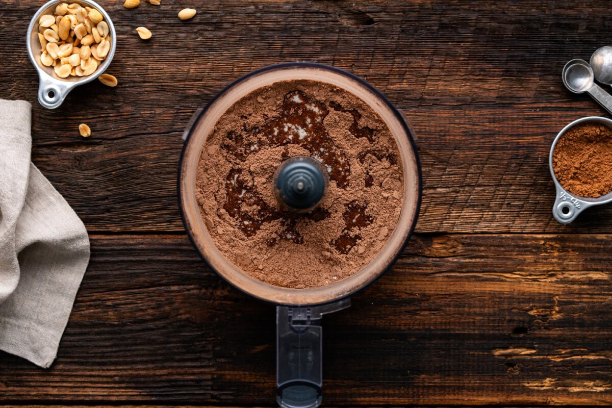graham cracker crumbs pulsed with cocoa powder, sugar, and melted butter in a food processor