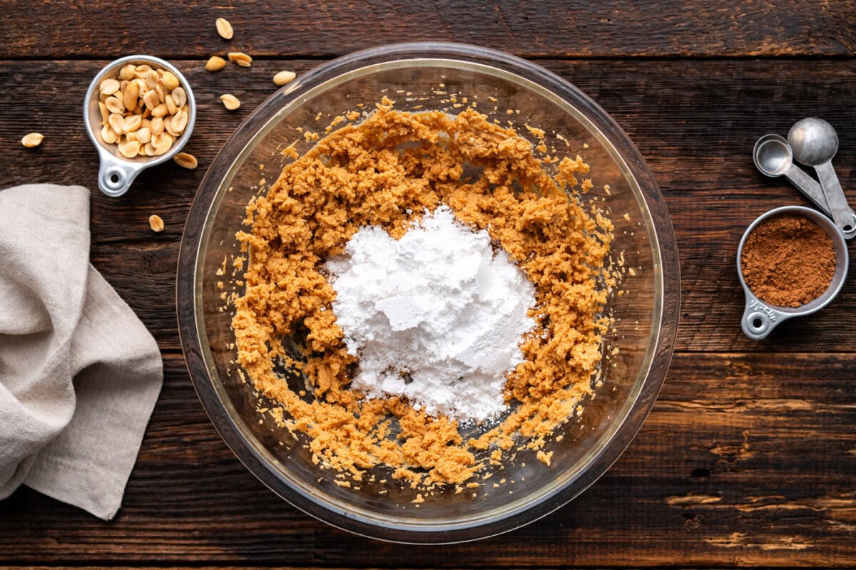 adding powdered sugar to peanut butter filling