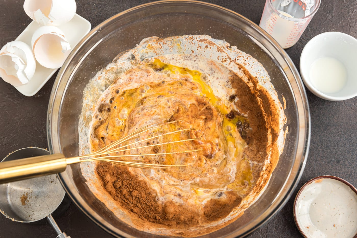 whisking pumpkin pie ingredients together in a bowl