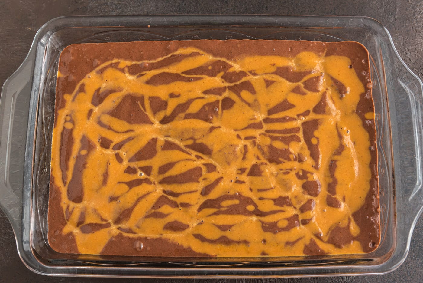 pumpkin pie mixture drizzled over chocolate cake mix