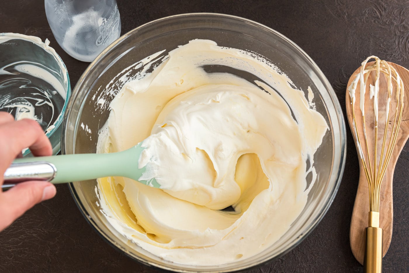 prepared vanilla mousse in a bowl with a rubber spatula