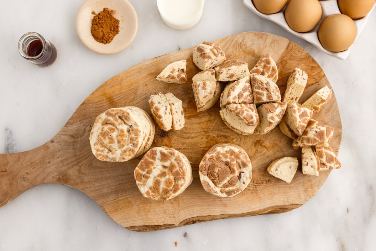cinnamon rolls chopped on a cutting board