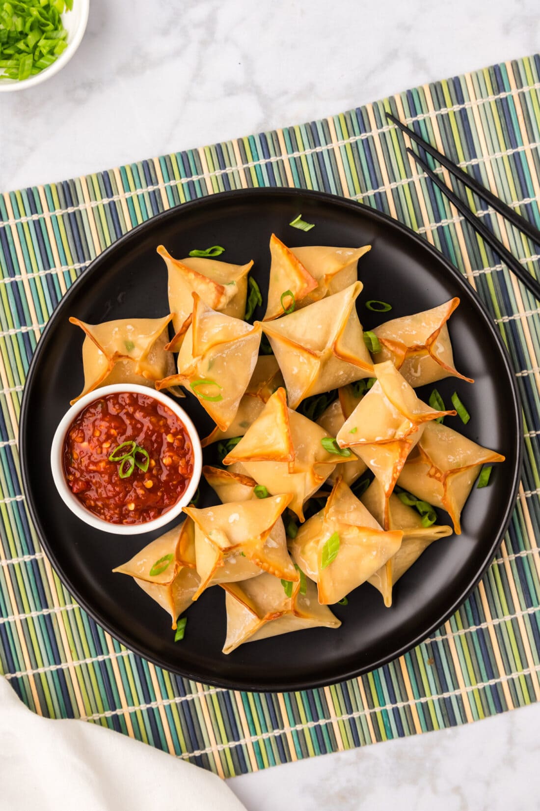 Overhead photo of a plate of Crab Rangoons
