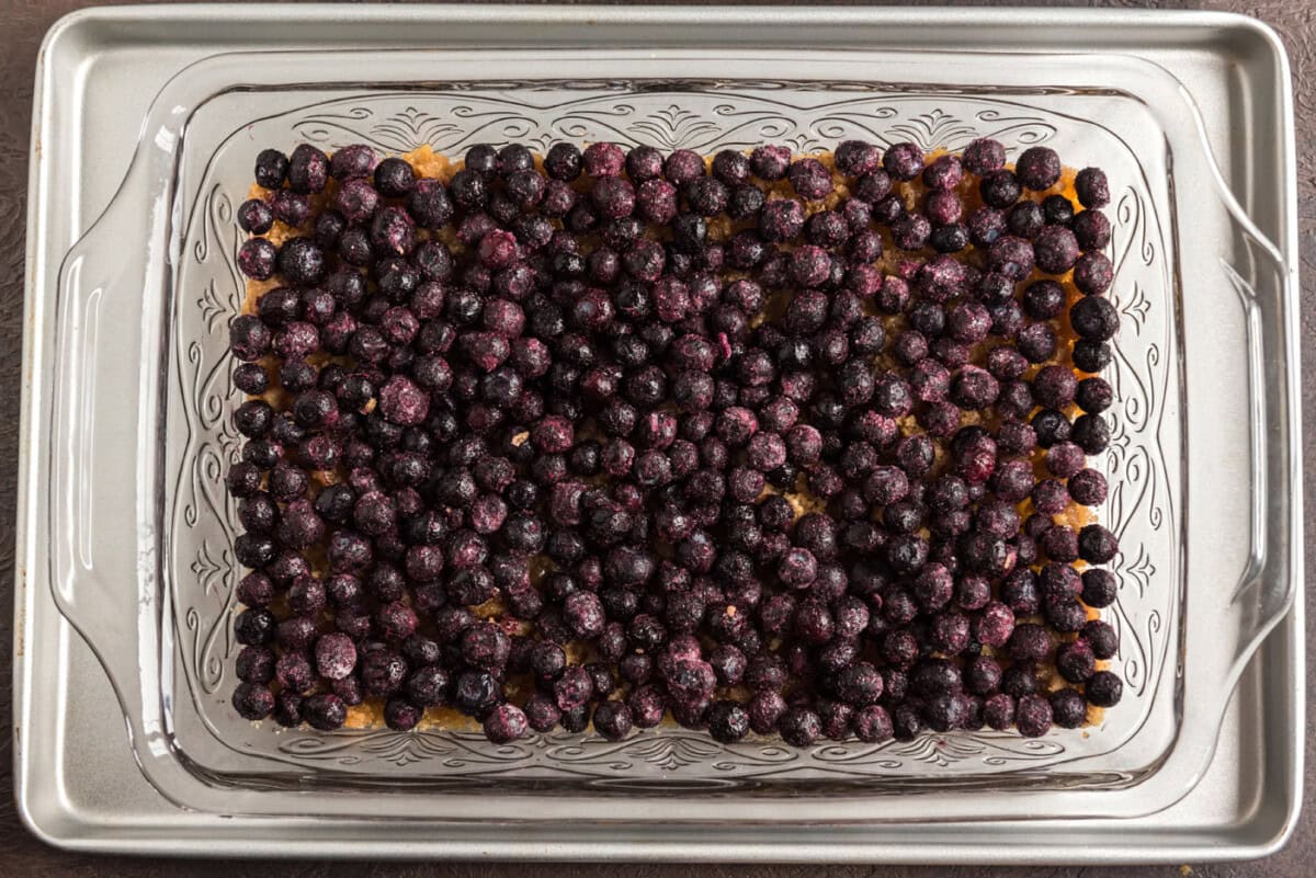 blueberries added on top of brown sugar and butter mixture