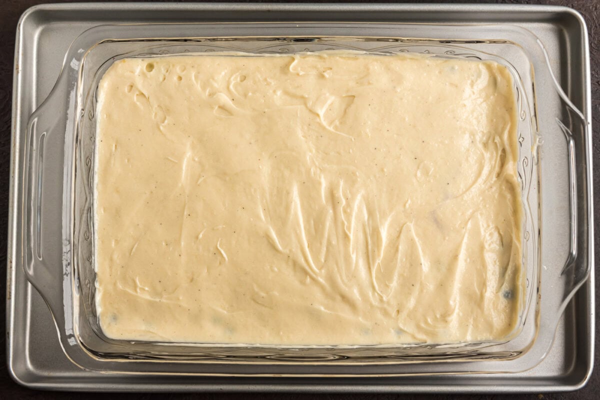 blueberry upside down cake batter in a dish