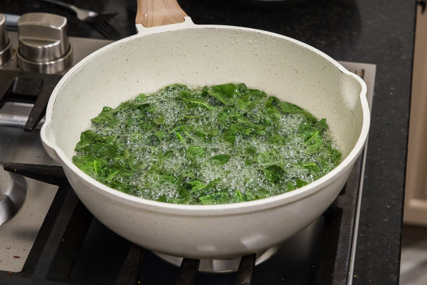 spinach frying in oil