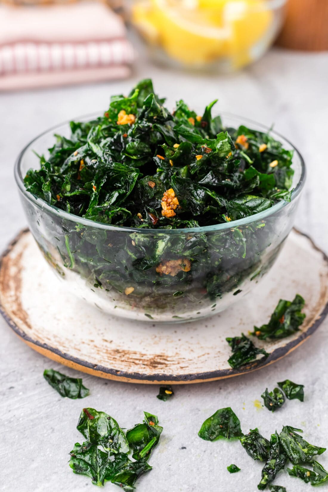 Bowl of Fried Spinach with pieces on the table