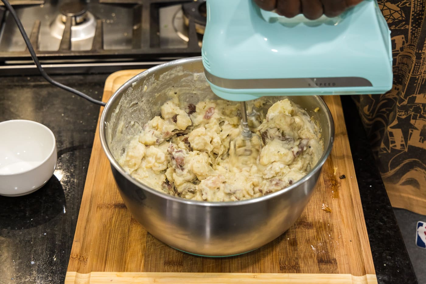 blending garlic mashed potatoes with a hand mixer