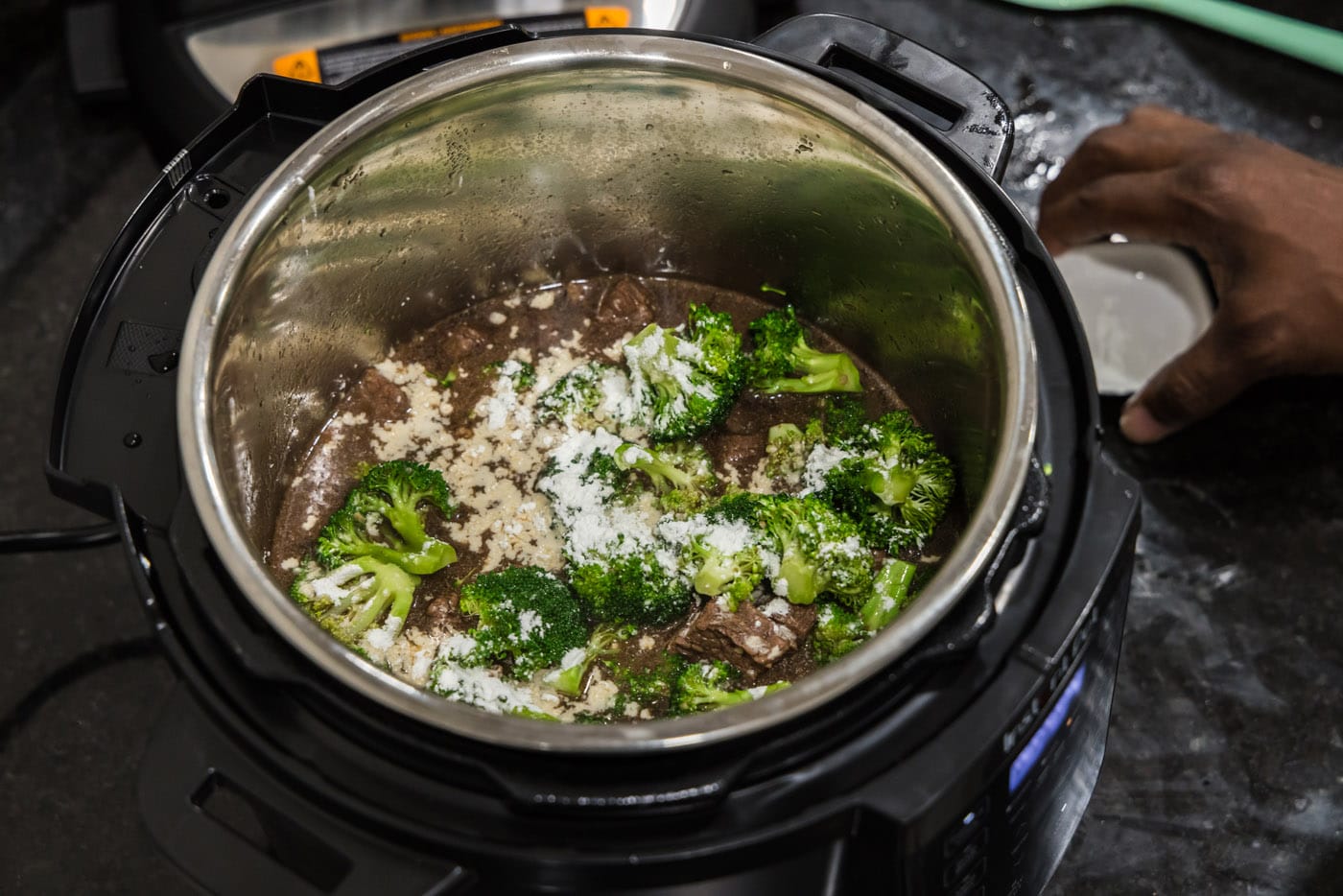 cornstarch sprinkled over broccoli in insant pot