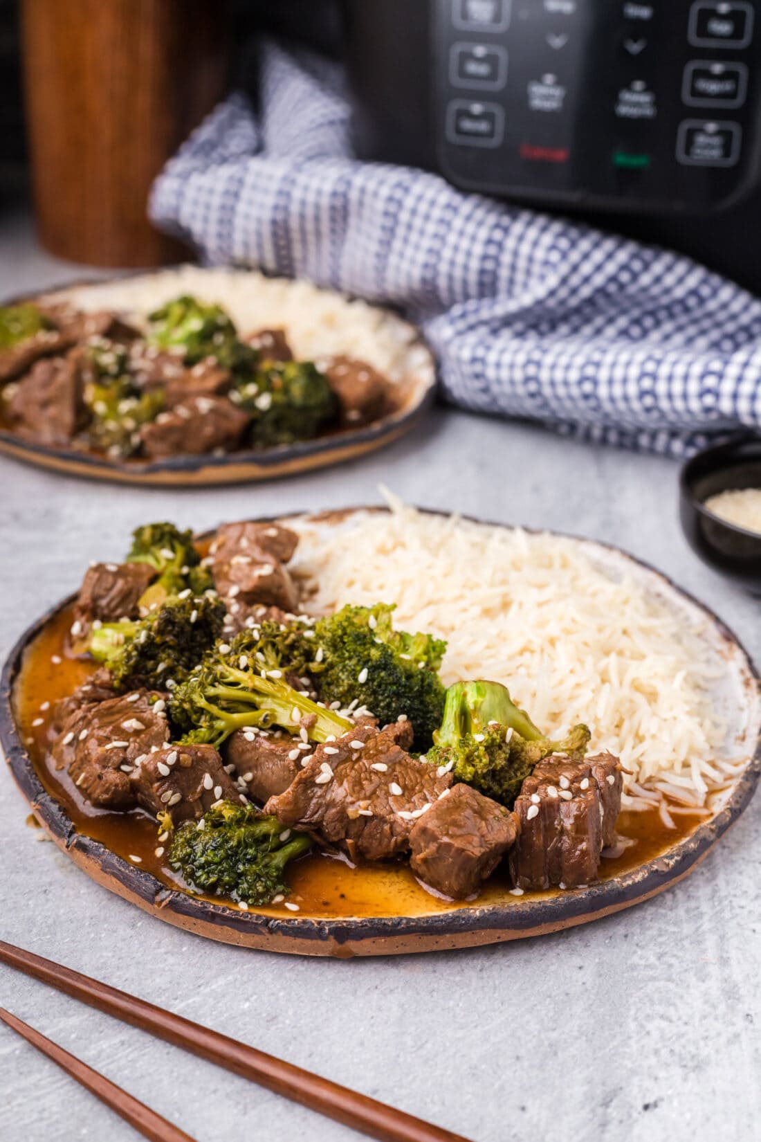 Plate of Instant Pot Beef and Broccoli with rice on the side