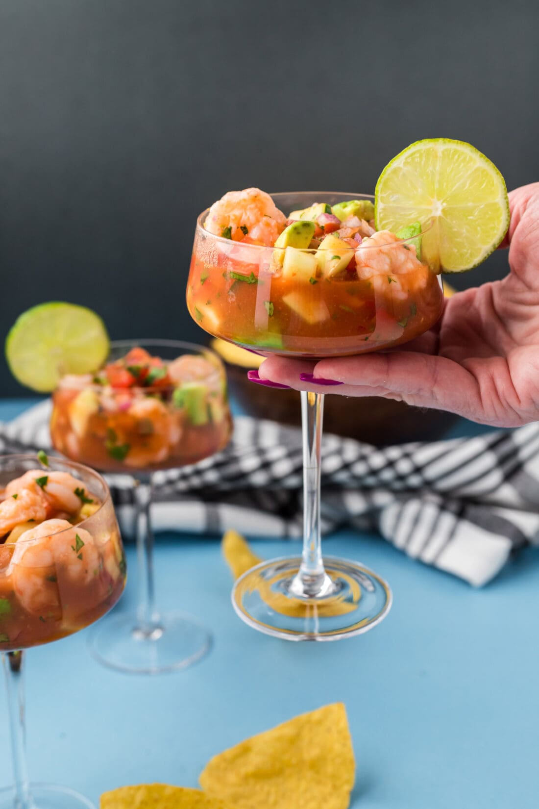 Hand holding up a Mexican Shrimp Cocktail