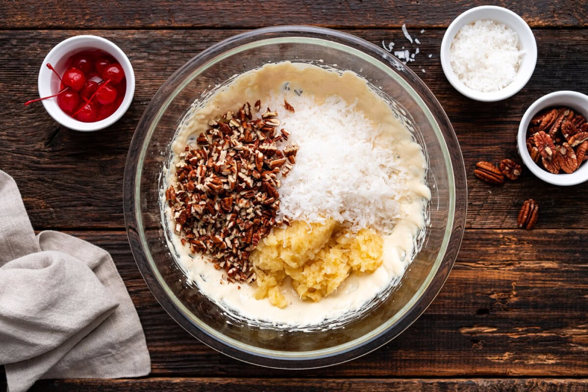 shredded coconut, crushed pineapple, and pecans added to sweetened condensed milk mixture