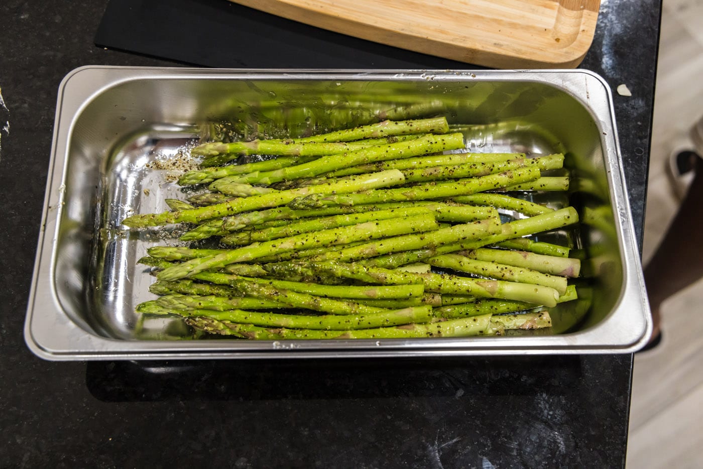 seasoned asparagus spears in a tray
