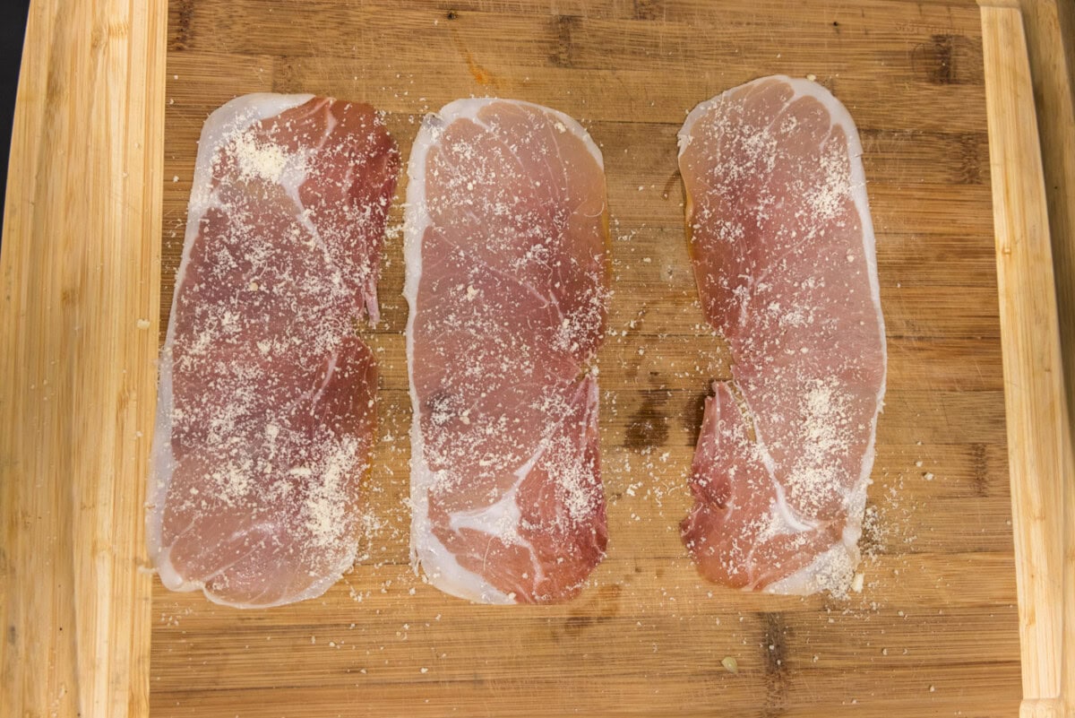 prosciutto slices with grated parmesan cheese