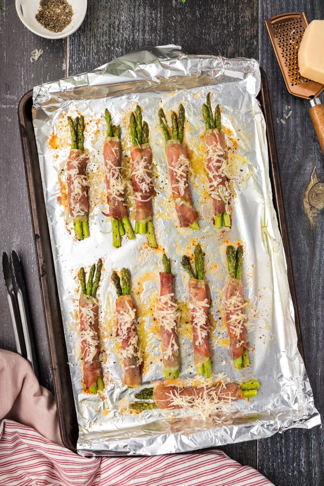 Prosciutto Wrapped Asparagus on a sheet pan