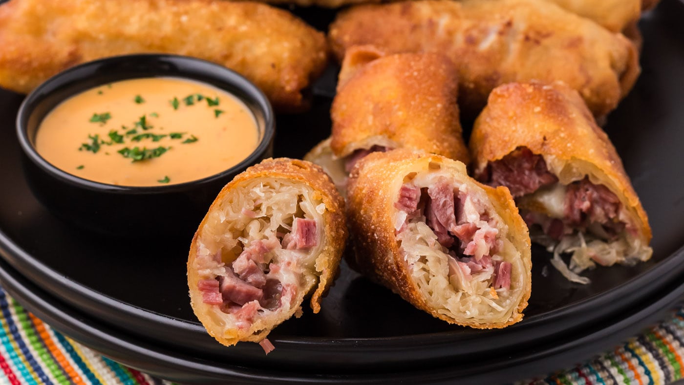 These little 4 ingredient reuben egg rolls are absolutely mouthwatering with sauerkraut, Swiss chees