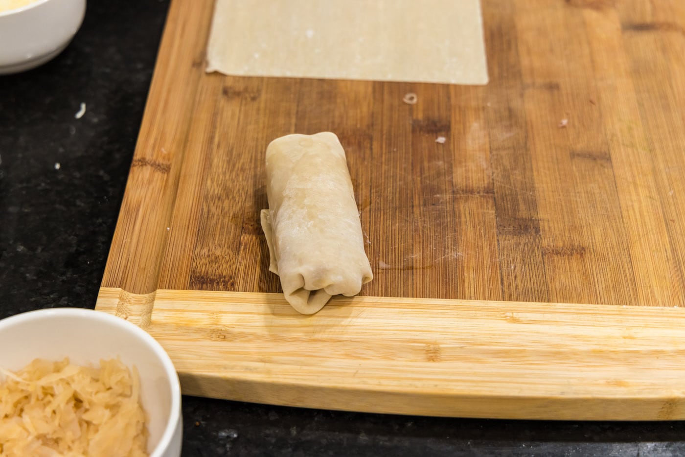 reuben egg roll on a cutting board