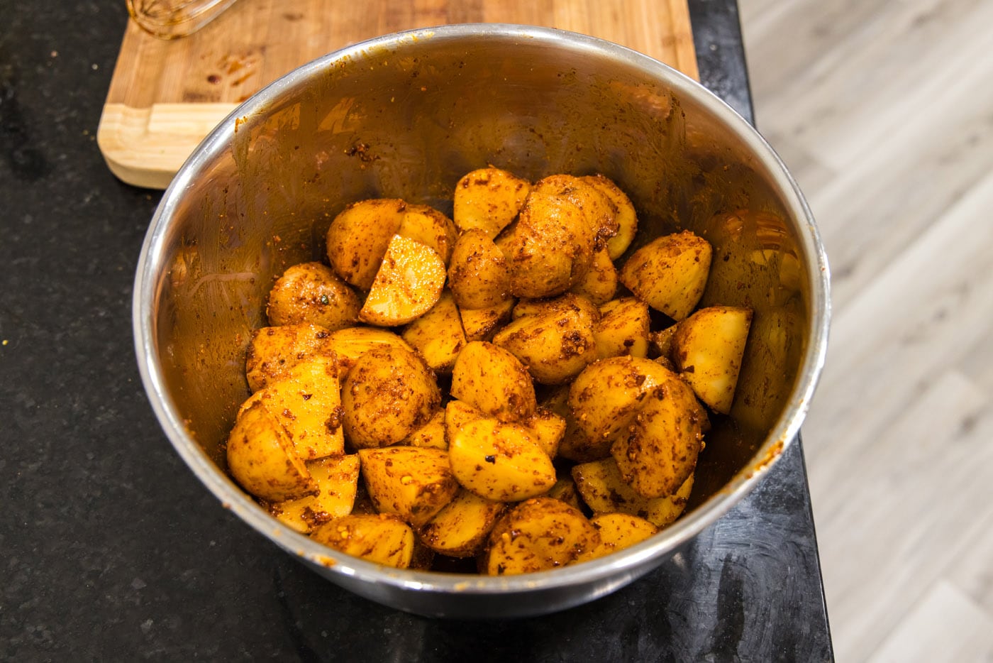 spicy roast potatoes in a mixing bowl