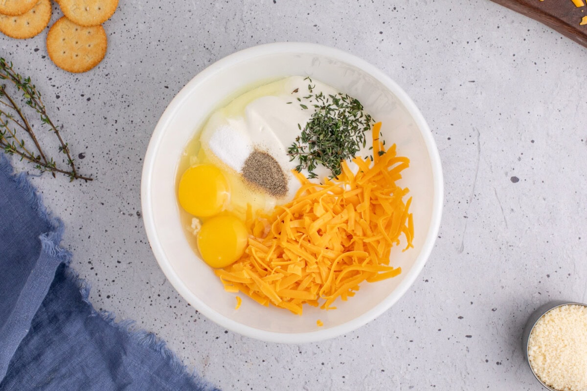 ingredients for yellow squash casserole in a bowl