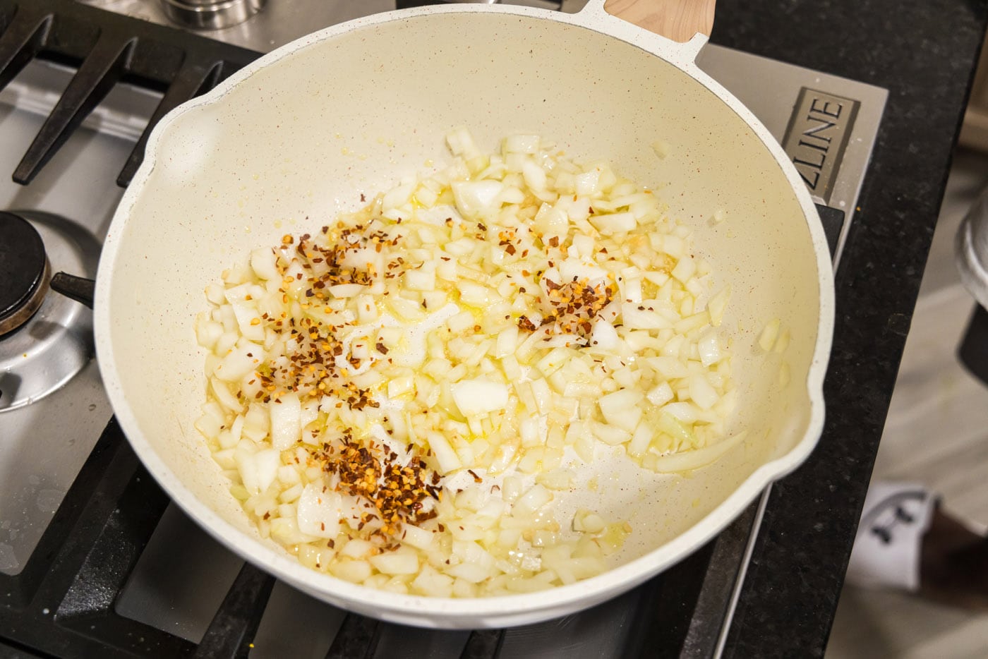 garlic, onion, and red pepper flakes in a skillet of oil
