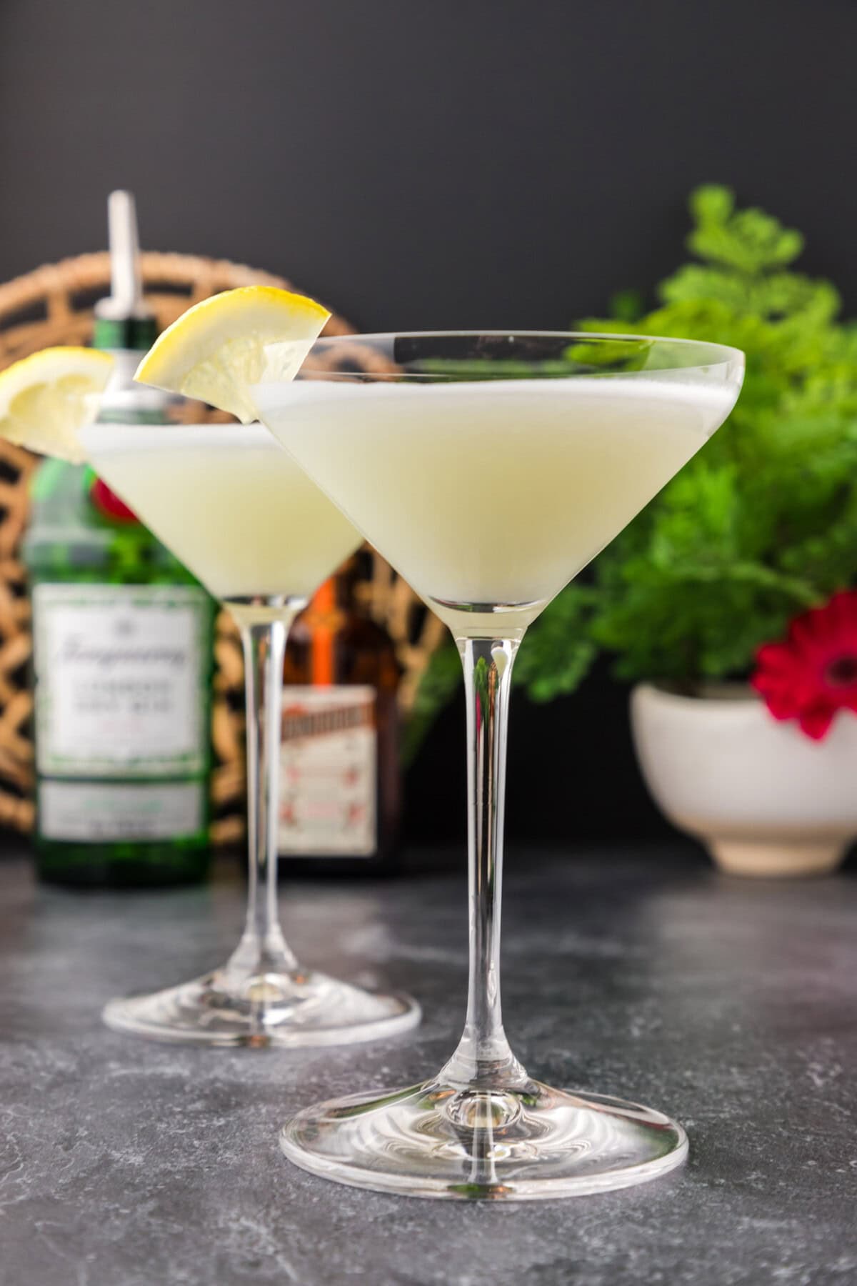 Two White Lady Cocktails garnished with a lemon wedge