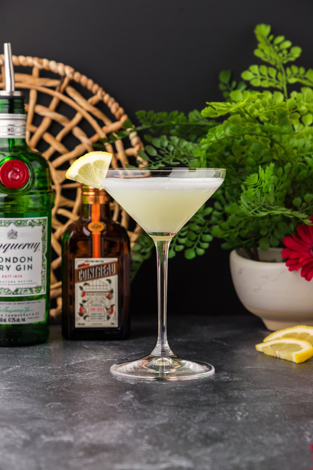 White Lady Cocktail with ingredients in the background