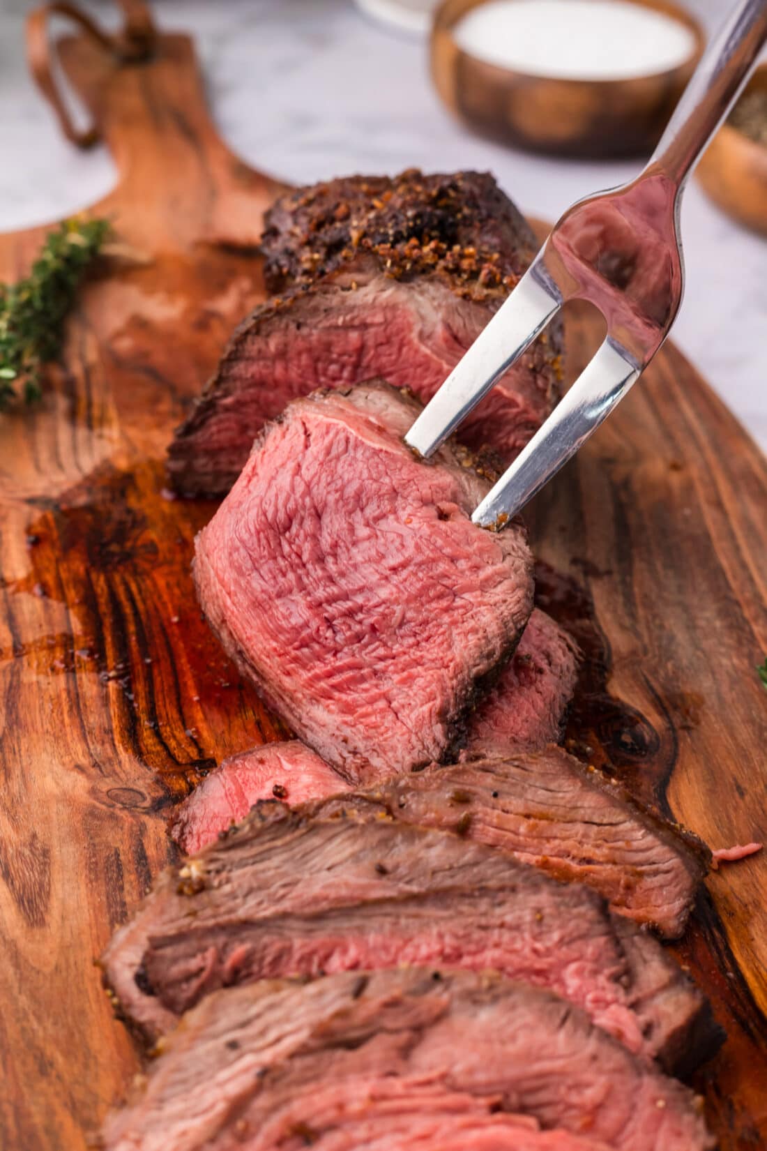 Slice of Air Fryer Roast Beef on a carving fork