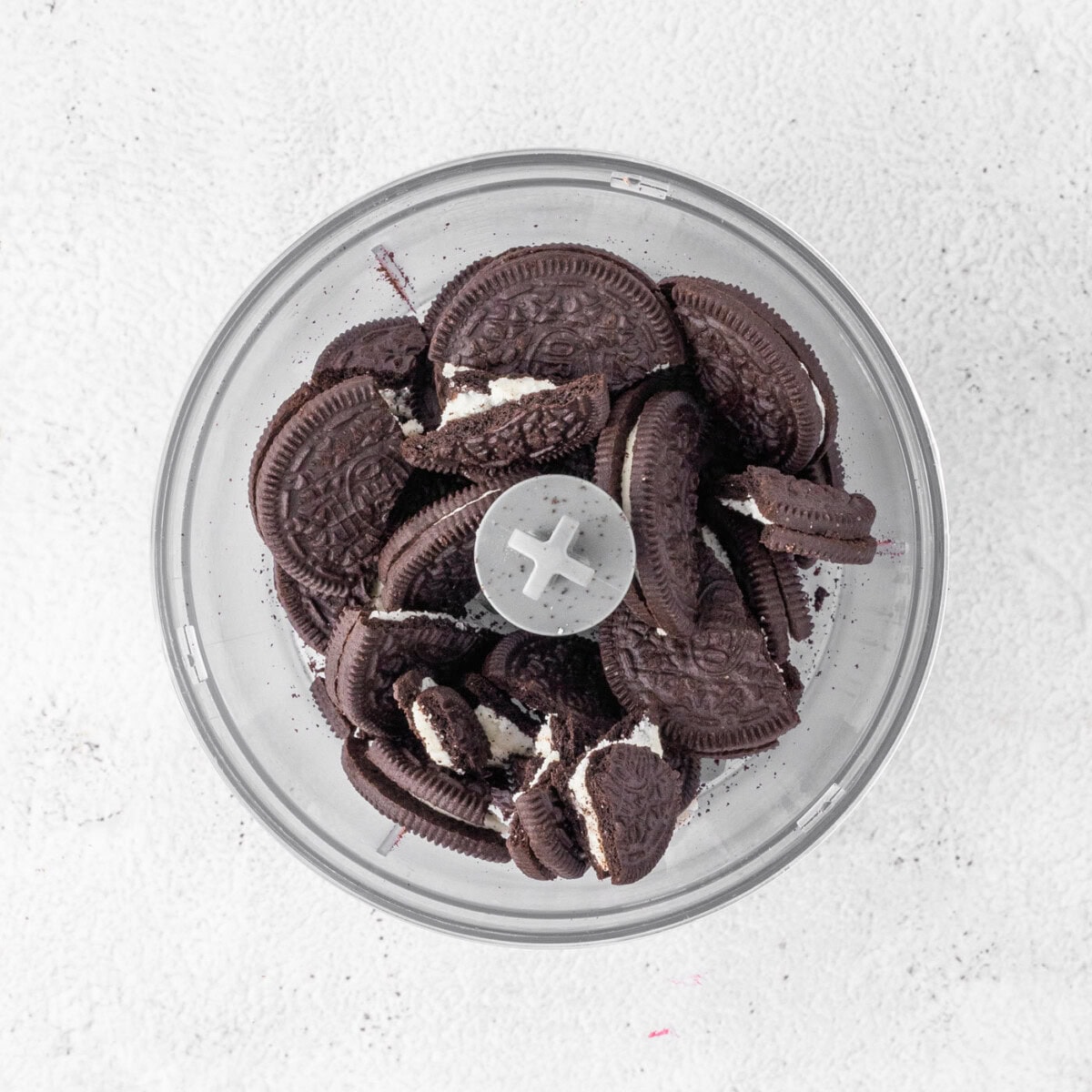 crushing Oreo cookies in a food processor