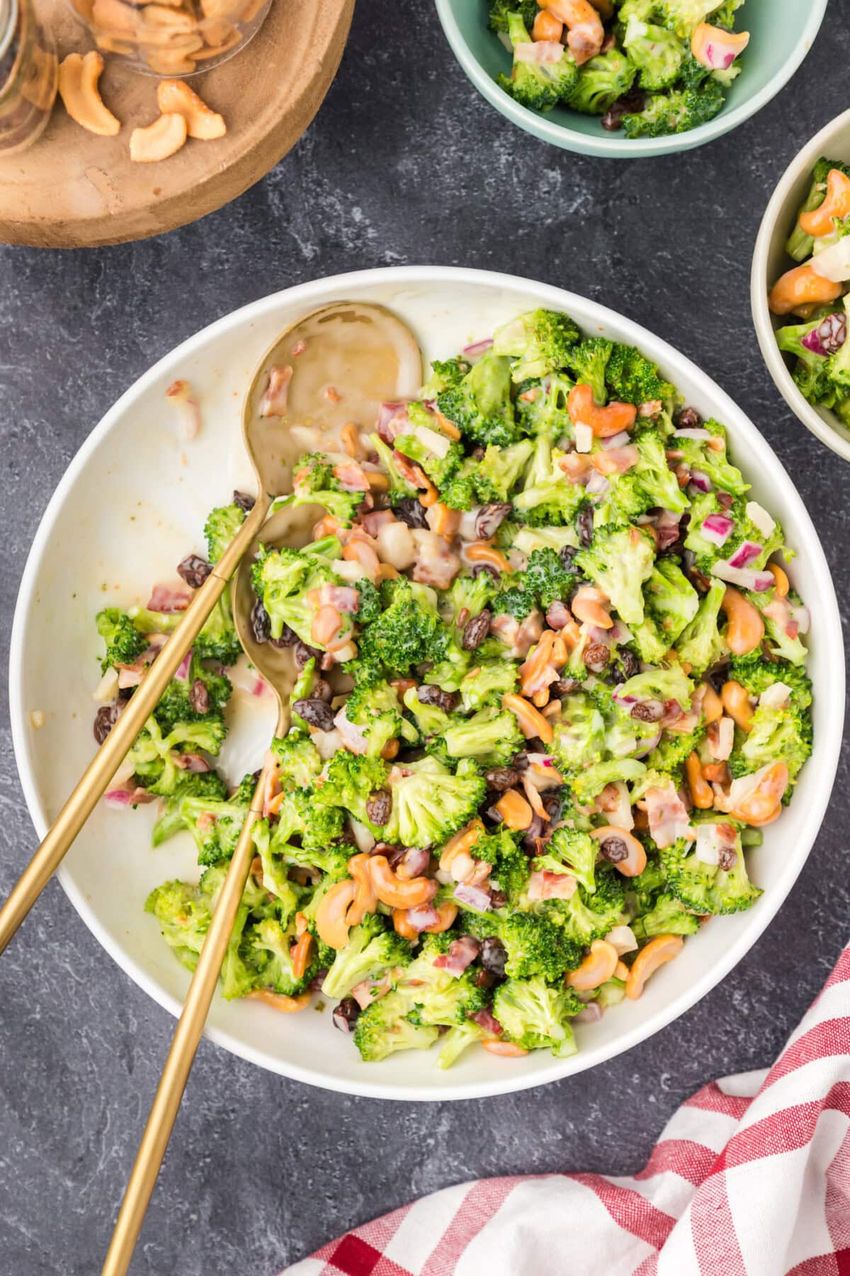 Bowl of Broccoli Cashew Salad with two spoons in it