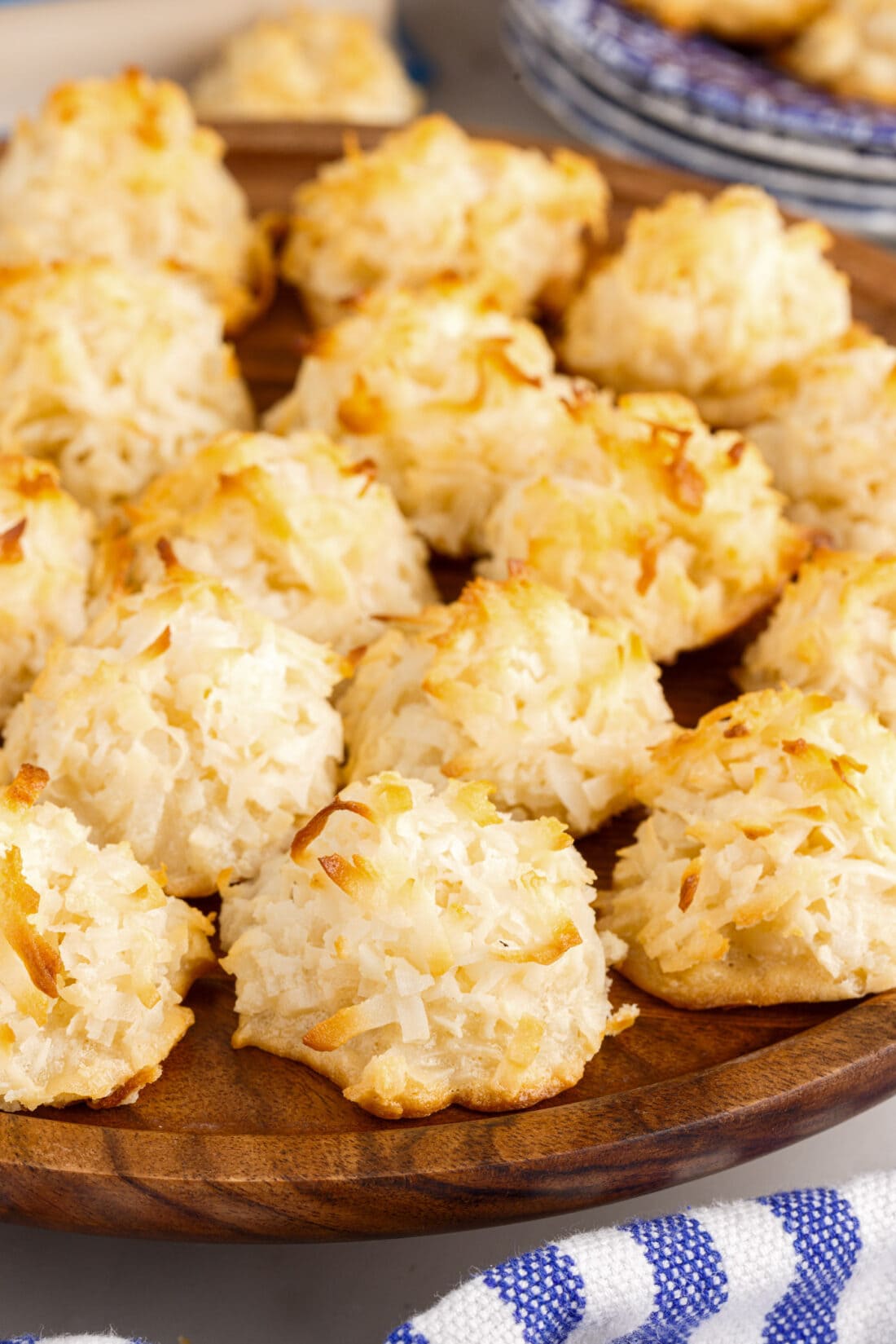 Coconut Macaroons pilled on a wooden platter