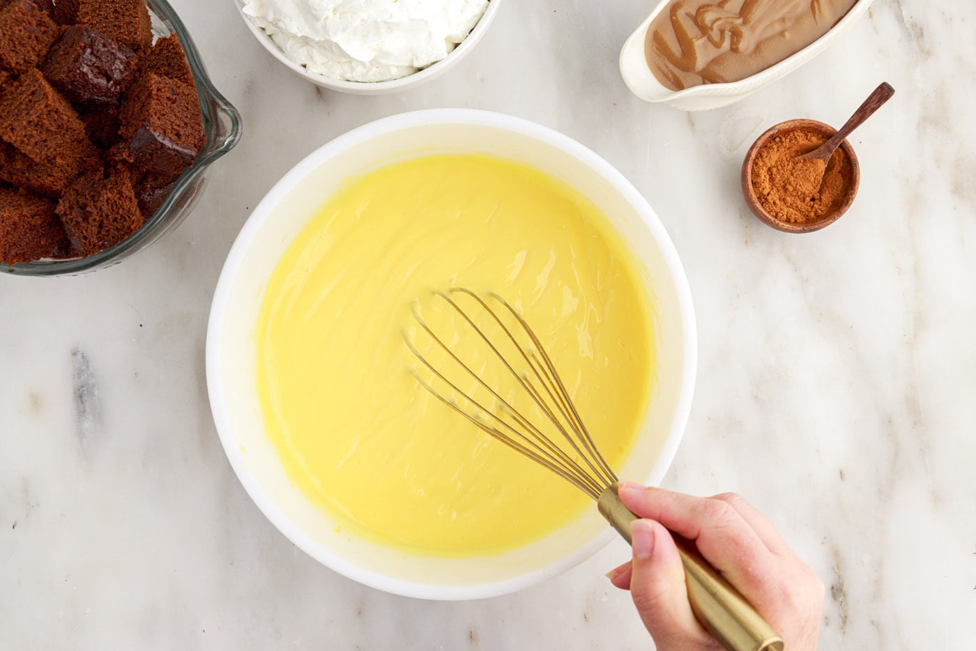 whisking instant vanilla pudding in a bowl