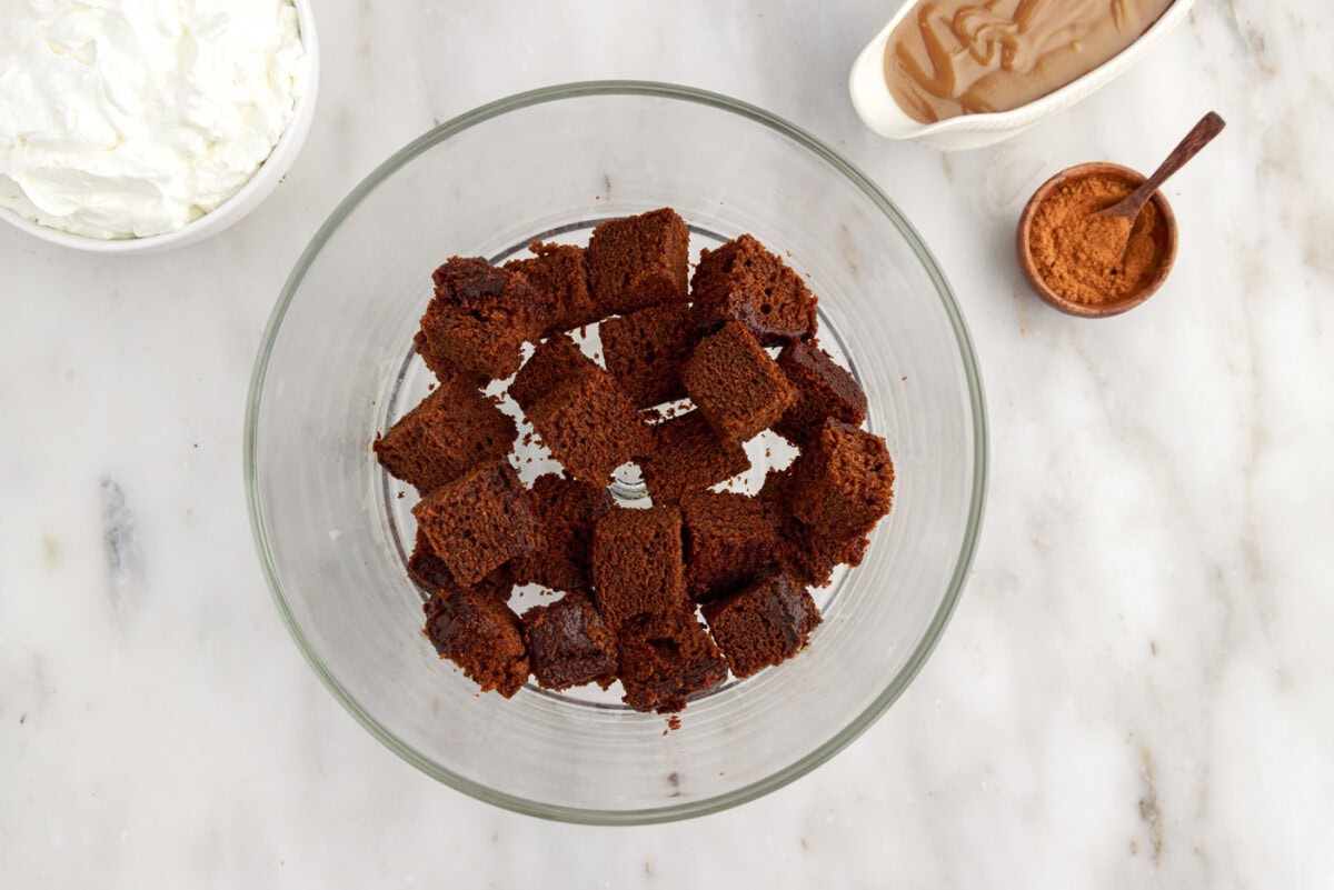 cubed gingerbread cake in a trifle bowl