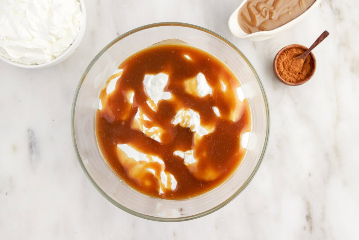 caramel sauce layer over whipped cream in trifle