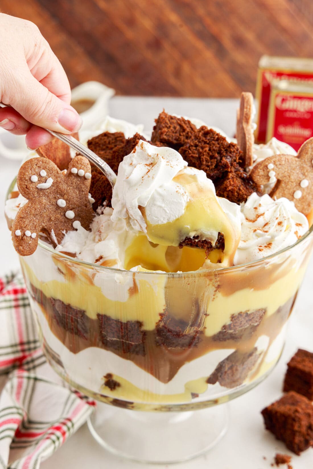 Spoonful of Gingerbread Trifle being lifted out of the trifle bowl