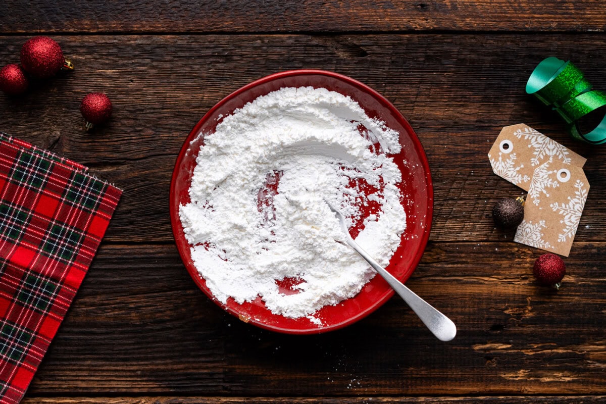 mixing together cornstarch and powdered sugar on a plate