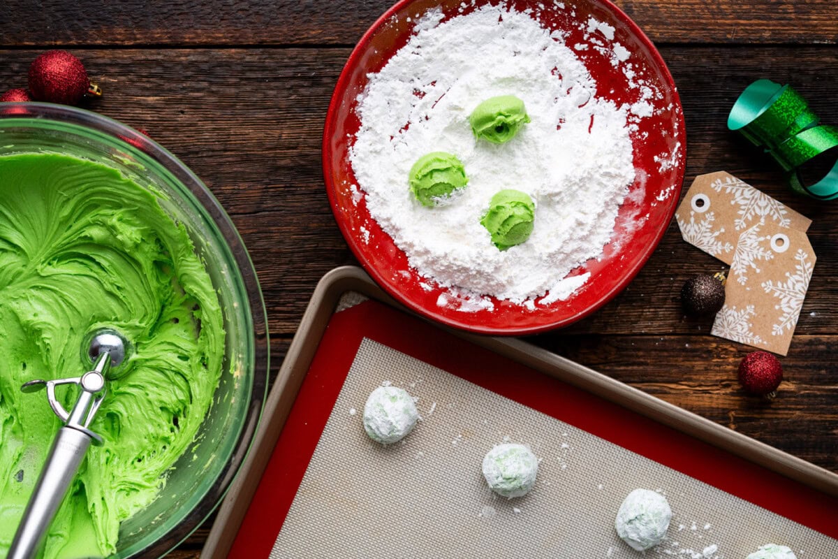 grinch dough balls rolled in powdered sugar