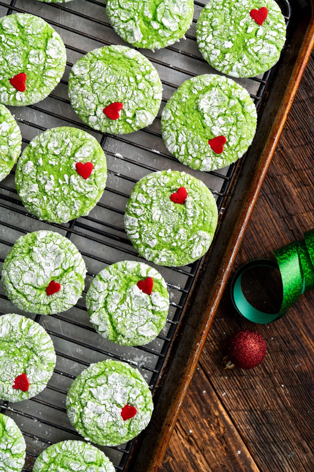 Grinch Cookies on a wire rack 