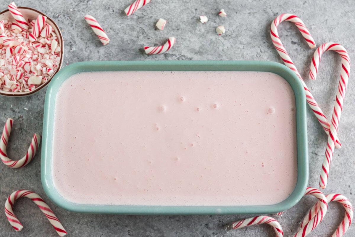 homemade pink peppermint ice cream in a container