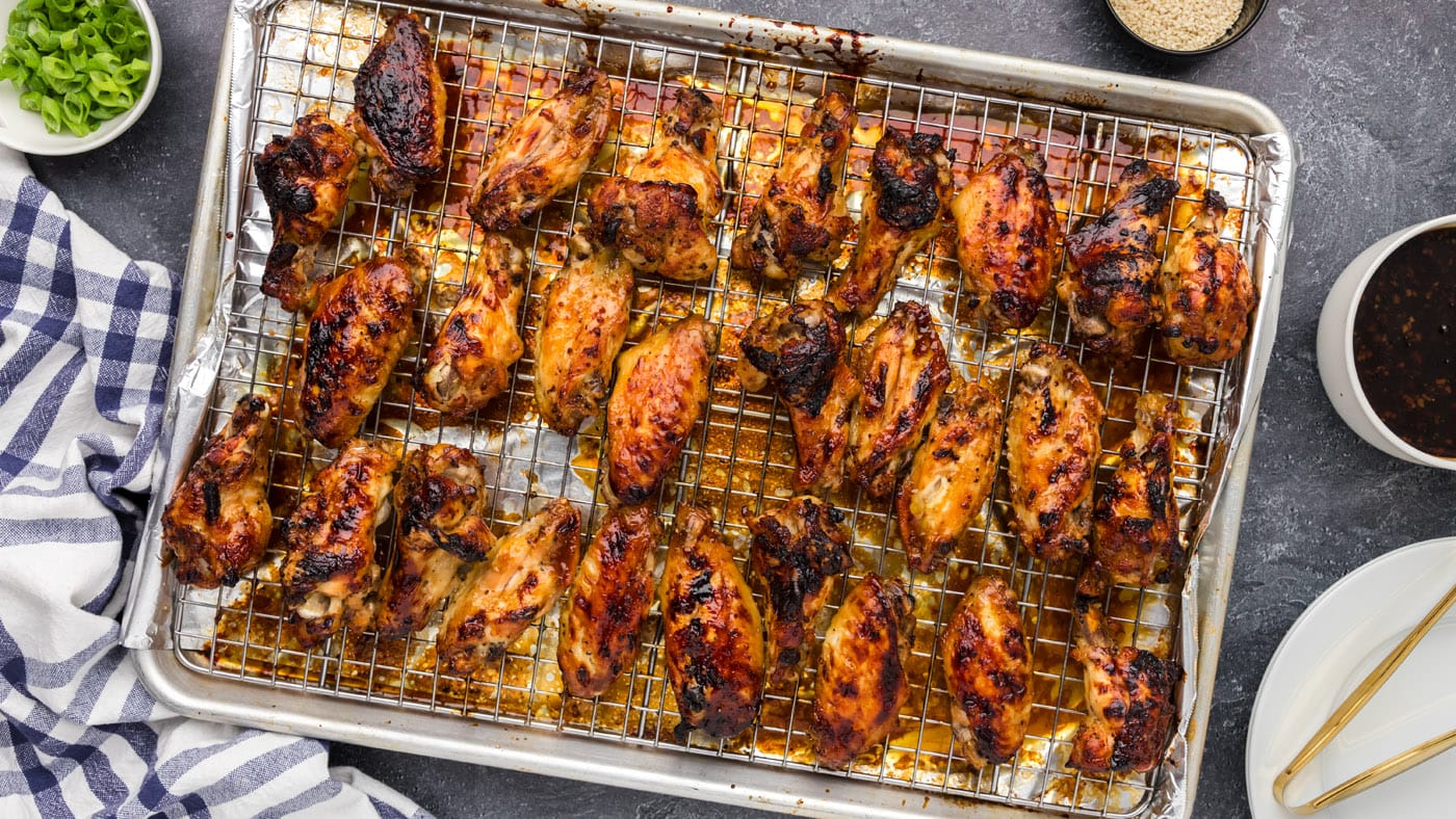Juicy chicken wings coated in a sticky honey garlic glaze make one heck of a party appetizer.