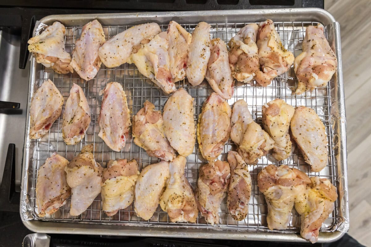 raw chicken wings on a baking sheet