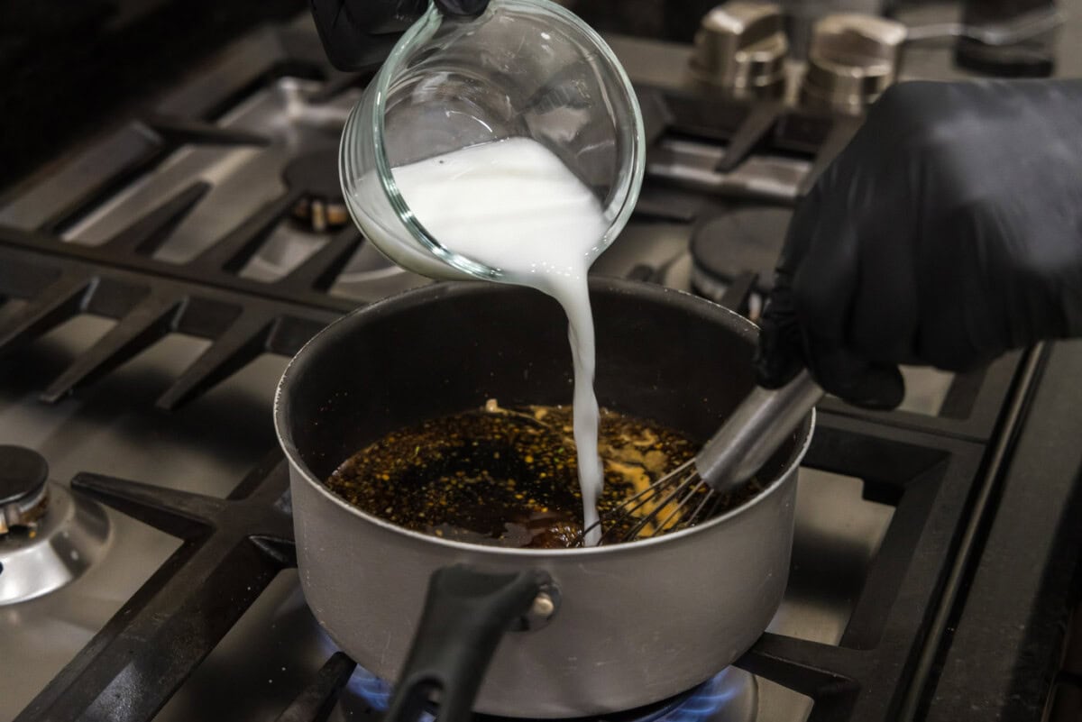 adding cornstarch slurry to thicken honey garlic sauce