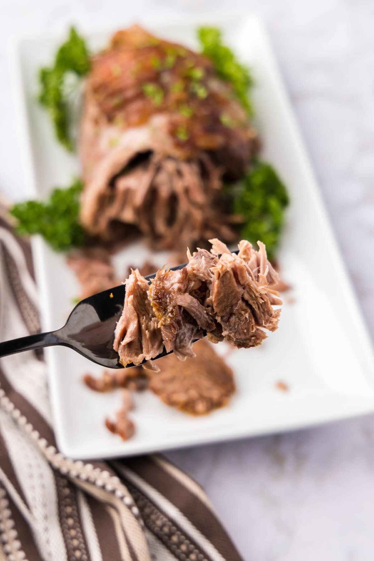 Pieces of Leg of Lamb on a fork