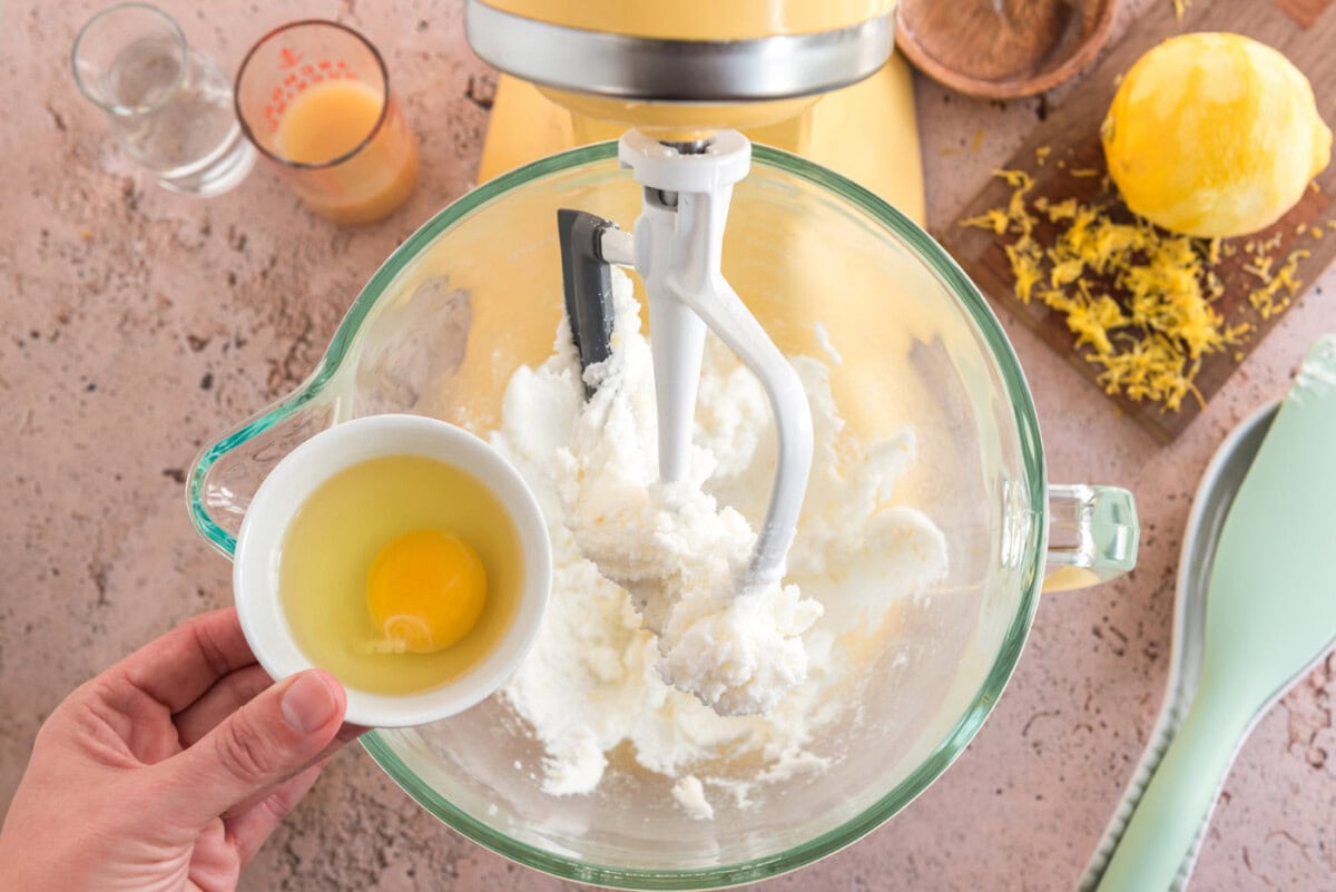 adding egg to lemon cookie dough
