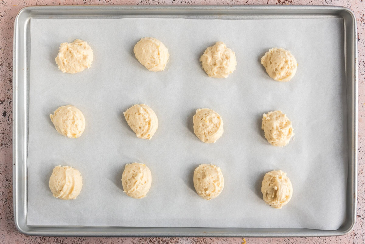 cookie dough balls on a baking sheet
