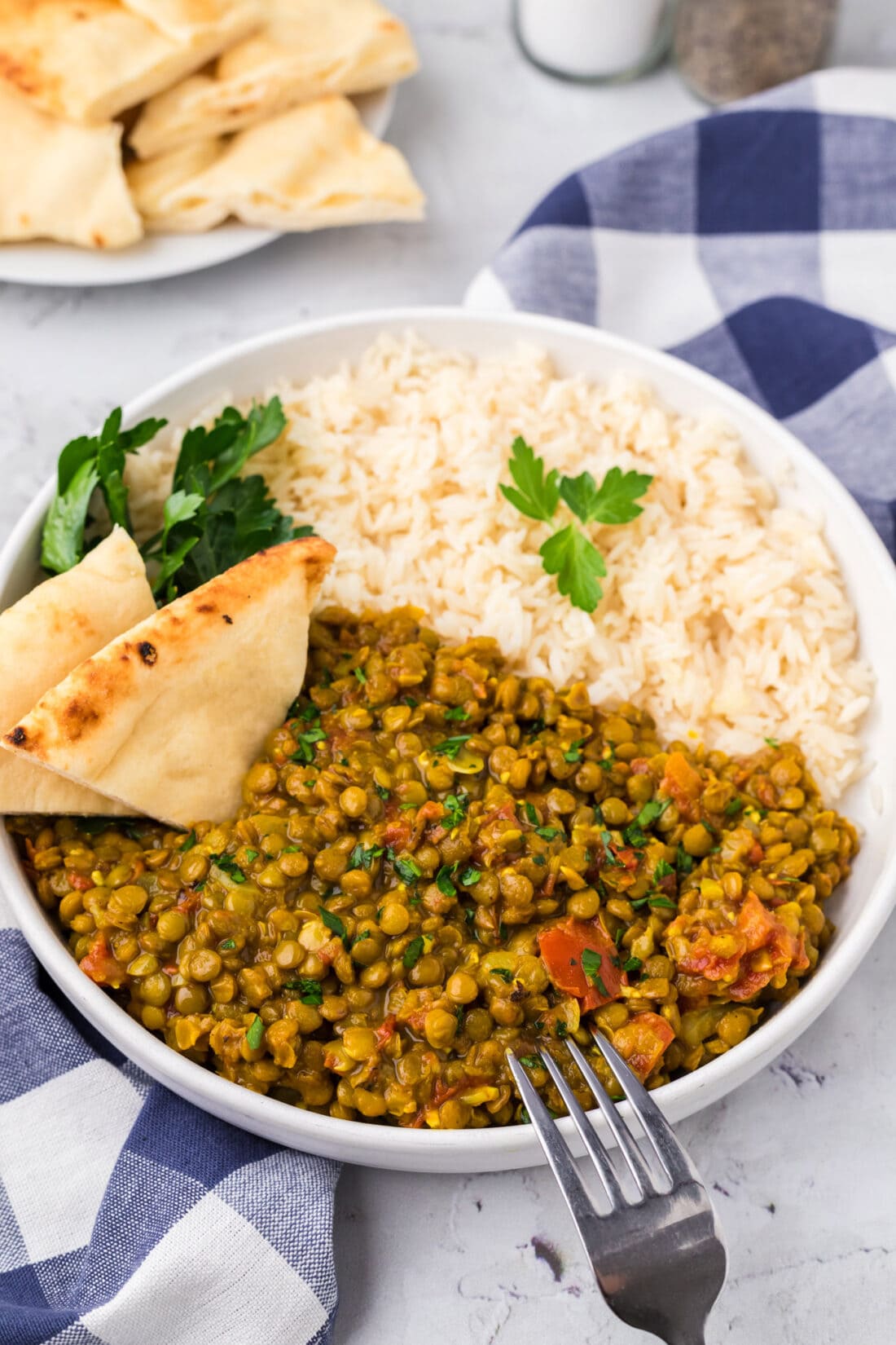 Bowl of Lentil Curry with rice and bread