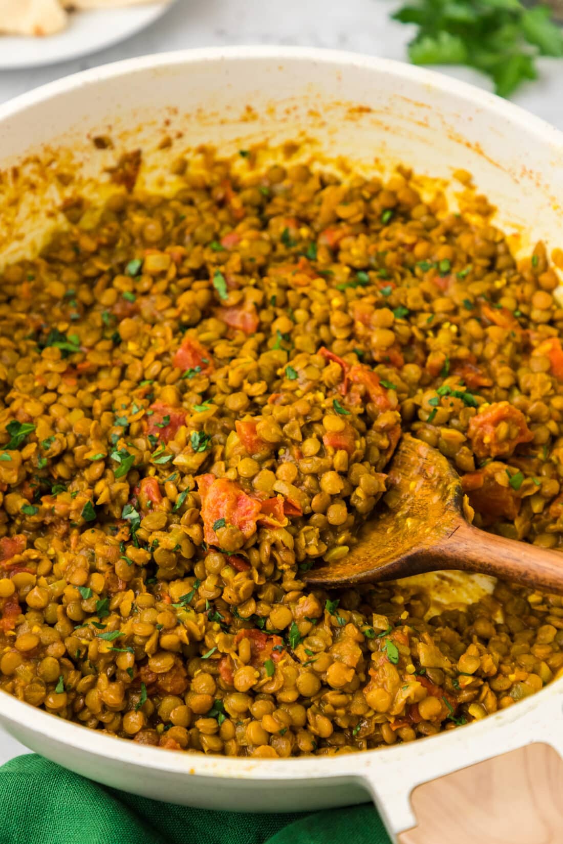 Skillet of Lentil Curry with a spoon in it