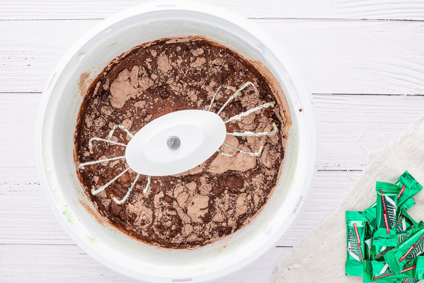 chocolate fudge pudding mix with milk in a mixer bowl