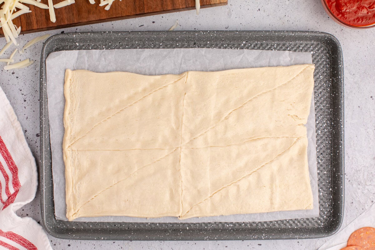 crescent roll dough on a baking sheet